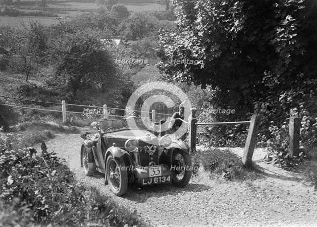 1932 MG J1 taking part in a West Hants Light Car Club Trial, Ibberton Hill, Dorset, 1930s. Artist: Bill Brunell.