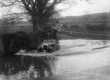 1932 Morris Minor tourer driving through a ford during a motoring trial, 1936. Artist: Bill Brunell