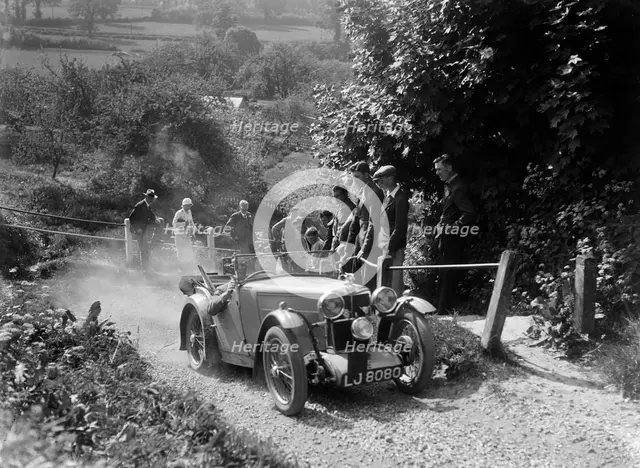 1933 MG J1 taking part in a West Hants Light Car Club Trial, Ibberton Hill, Dorset, 1930s. Artist: Bill Brunell.
