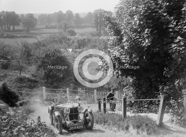 1933 MG J2 Standard taking part in a West Hants Light Car Club Trial, Ibberton Hill, Dorset, 1930s. Artist: Bill Brunell.