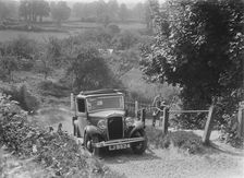 1934 Austin Ten taking part in a West Hants Light Car Club Trial, Ibberton Hill, Dorset, 1930s. Artist: Bill Brunell