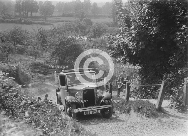 1934 Austin Ten taking part in a West Hants Light Car Club Trial, Ibberton Hill, Dorset, 1930s. Artist: Bill Brunell.