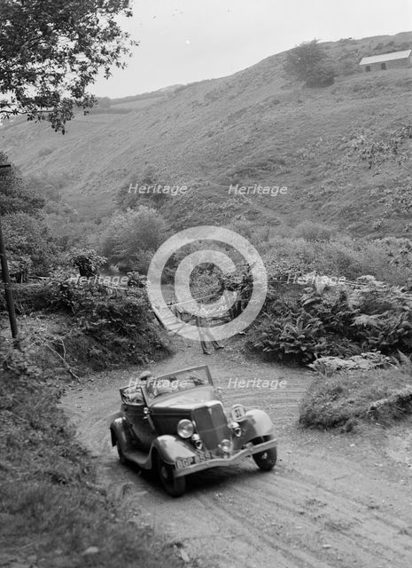 1934 Ford V8 tourer taking part in a motoring trial, late 1930s. Artist: Bill Brunell.