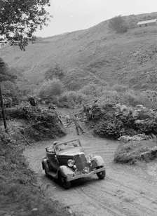 1934 Ford V8 tourer taking part in a motoring trial, late 1930s. Artist: Bill Brunell