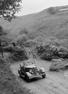 1934 Ford V8 tourer taking part in a motoring trial, late 1930s. Artist: Bill Brunell