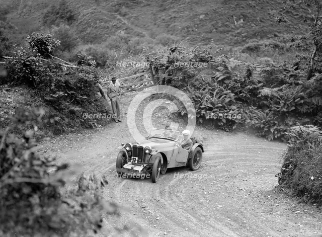 1934 MG PA of the Cream Cracker team taking part in a motoring trial in Devon, late 1930s. Artist: Bill Brunell.