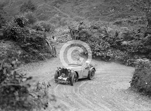1934 MG PA of the Cream Cracker team taking part in a motoring trial in Devon, late 1930s. Artist: Bill Brunell.