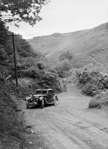 1934 Riley Falcon saloon taking part in a motoring trial in Devon, late 1930s. Artist: Bill Brunell