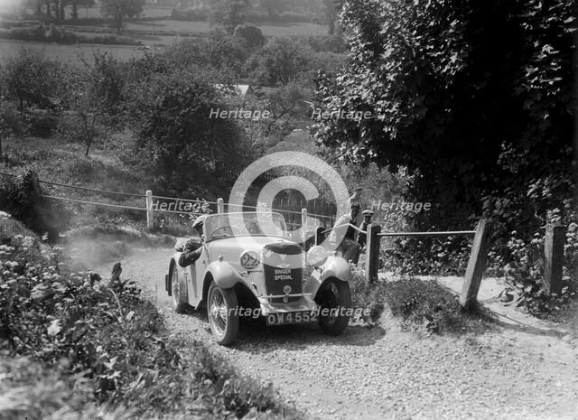 1934 Singer Le Mans taking part in a West Hants Light Car Club Trial, Ibberton Hill, Dorset, 1930s. Artist: Bill Brunell.