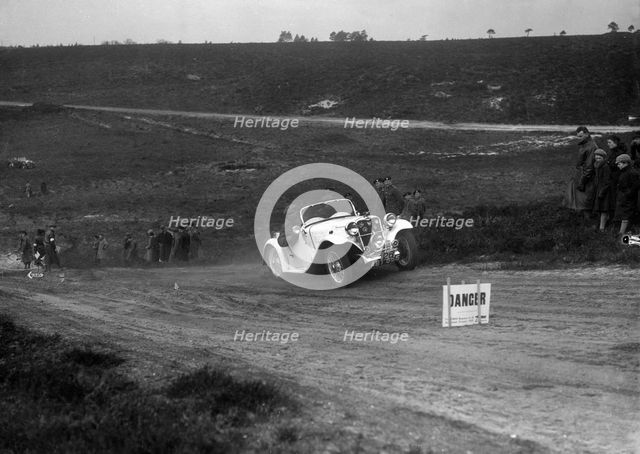 1934 Singer Le Mans competing in a motoring trial, Bagshot Heath, Surrey, 1930s. Artist: Bill Brunell.