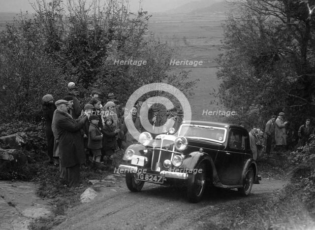 1934 Standard Avon Ten coupe taking part in a Standard Car Owners Club trial. Artist: Bill Brunell.