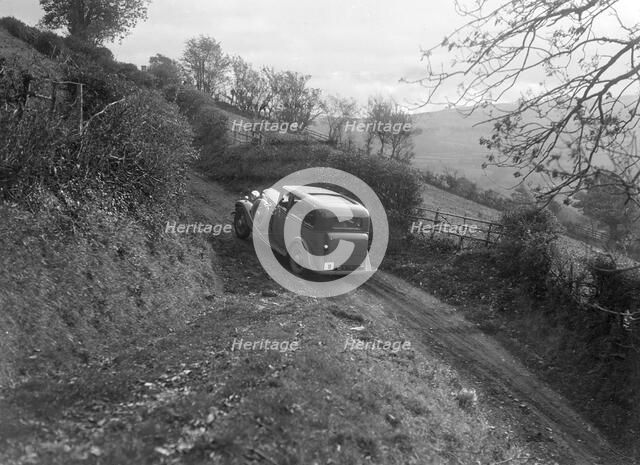 1934 Standard Sixteen taking part in a Standard Car Owners Club trial. Artist: Bill Brunell.