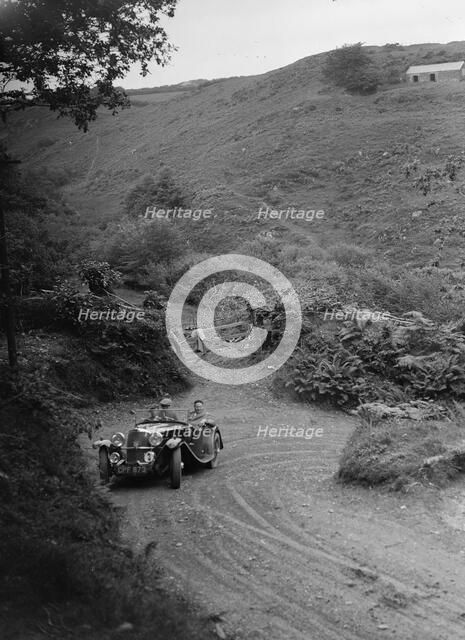1935 AC tourer taking part in a motoring trial, late 1930s. Artist: Bill Brunell.