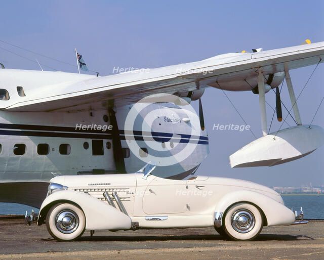 1935 Auburn 851 speedster with Sunderland flying boat. Artist: Unknown.