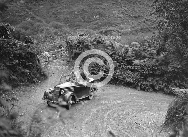 1935 Ford Ten tourer taking part in a motoring trial, late 1930s. Artist: Bill Brunell.