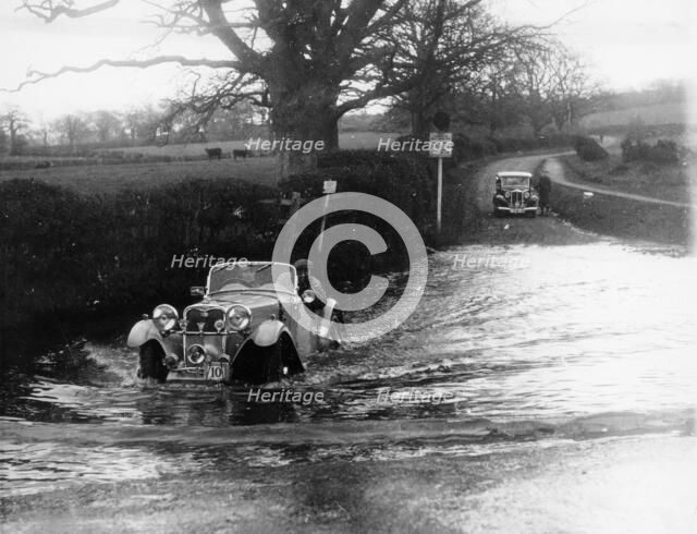 1935 Singer 1.5 Litre Le Mans taking part in a water splash trial, (1935?). Artist: Unknown