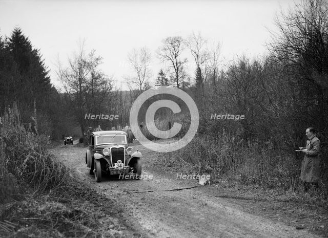 1935 Singer 9 fixed-head coupe competing in the Great West Motor Club Thatcher Trophy, 1938. Artist: Bill Brunell.