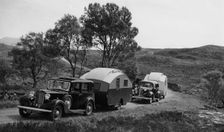1936 Austin Twenty with caravan and 1936 Oldsmobile Eight with caravan. Creator: Unknown