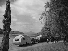 1936 Austin Twenty with caravan and 1936 Oldsmobile Eight with caravan. Creator: Unknown