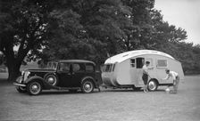 1936 Austin Twenty with caravan. Creator: Unknown