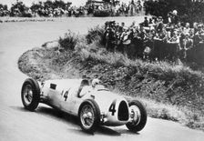 1936 Auto Union C type, Rosemeyer at German Grand Prix. Creator: Unknown