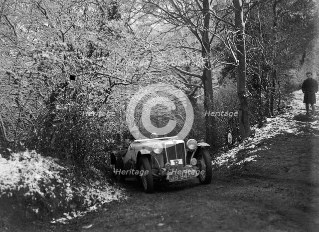 1936 MG TA taking part in a motoring trial, late 1930s. Artist: Bill Brunell.