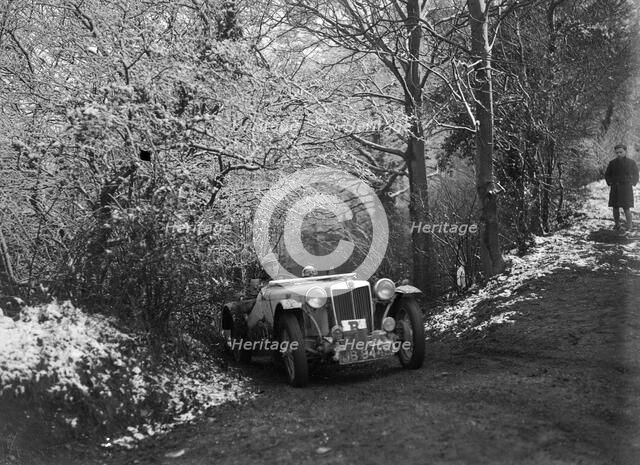 1936 MG TA taking part in a motoring trial, late 1930s. Artist: Bill Brunell.
