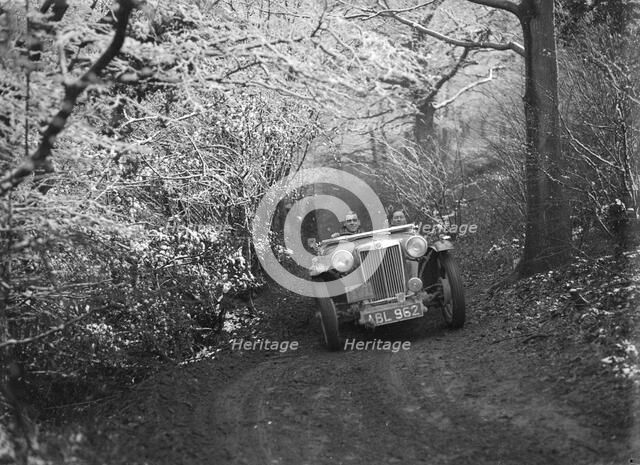 1936 MG TA of the Cream Cracker Team taking part in a motoring trial, late 1930s. Artist: Bill Brunell.