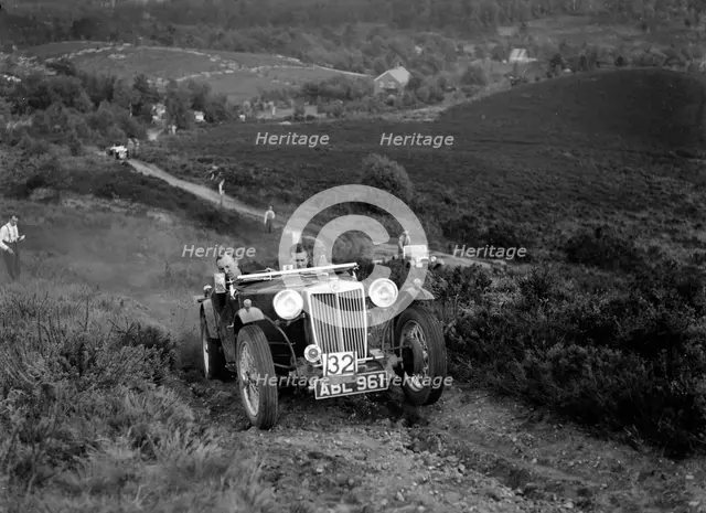 1936 MG TA of the Three Musketeers team taking part in the NWLMC Lawrence Cup Trial, 1937. Artist: Bill Brunell.