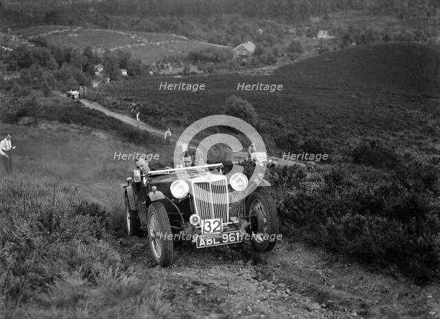 1936 MG TA of the Three Musketeers team taking part in the NWLMC Lawrence Cup Trial, 1937. Artist: Bill Brunell.