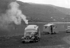 1937 Austin 12hp saloon with caravan. Creator: Unknown