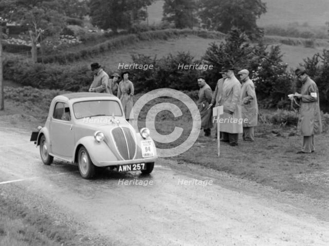 1937 Fiat 500 Coupe competing in the Welsh Rally. Artist: Unknown