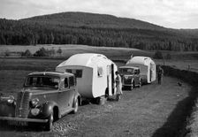 1937 Hillman 14 towing caravan. Creator: Unknown