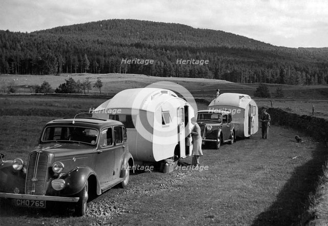 1937 Hillman 14 towing caravan. Creator: Unknown.