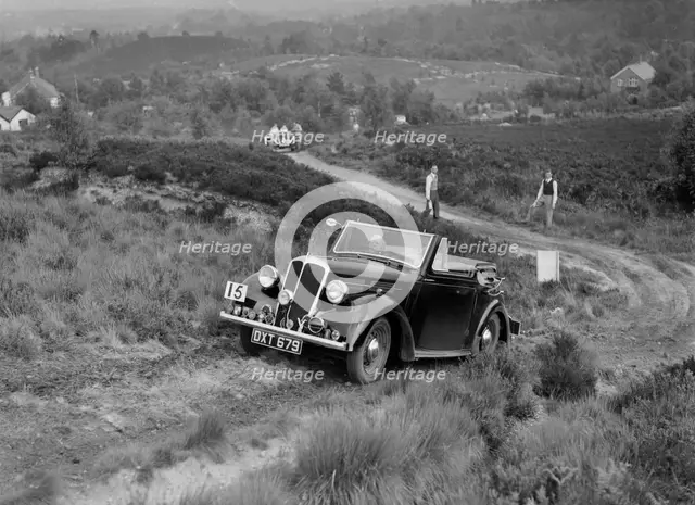 1937 Standard Twelve open 4-seater taking part in the NWLMC Lawrence Cup Trial, 1937. Artist: Bill Brunell.