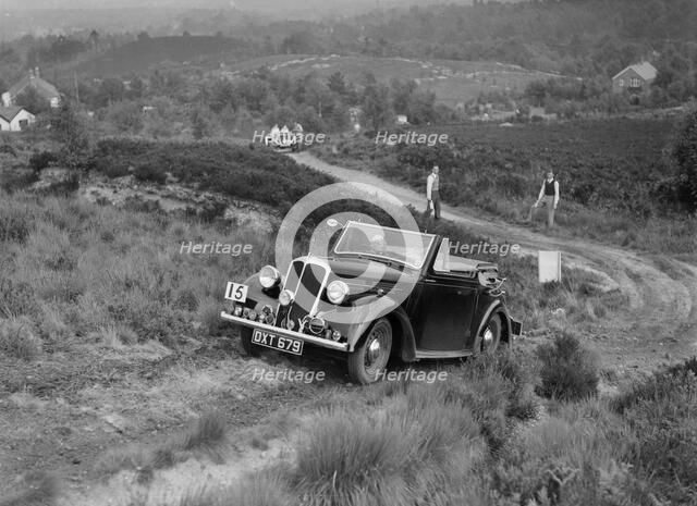 1937 Standard Twelve open 4-seater taking part in the NWLMC Lawrence Cup Trial, 1937. Artist: Bill Brunell.