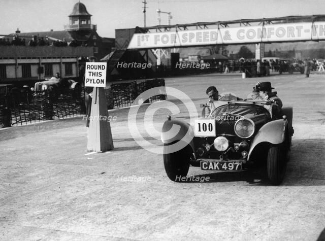 1938 S.S. 100 at Brooklands suring Junior Car Club event 25th March 1939 Artist: Unknown.