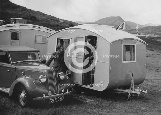 1939 Ausin Big Seven tourer with caravans. Creator: Unknown.