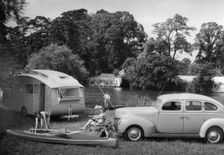 1939 Ford V8-91 with caravan. Creator: Unknown