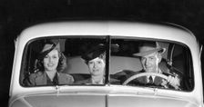 1939 Oldsmobile driver and female passengers. Creator: Unknown