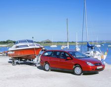 2002 Citroen C5 hdi towing a boat by harbour