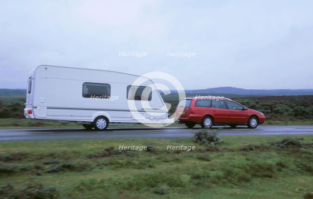 2002 Citroen C5 hdi towing a caravan. Artist: Unknown.
