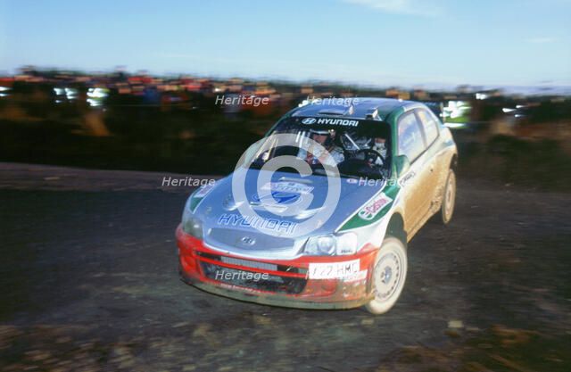 2002 Hyundai Accent WRC on 2002 Network Q rally, Kankkunen. Artist: Unknown.