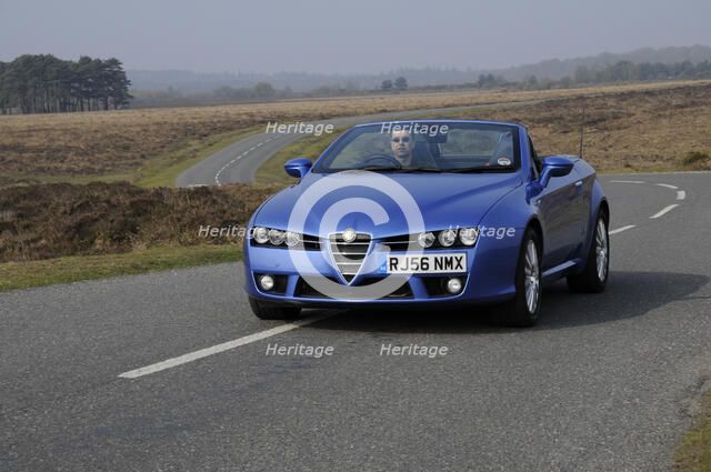 2006 Alfa Romeo Spyder driving in New Forest. Artist: Unknown.