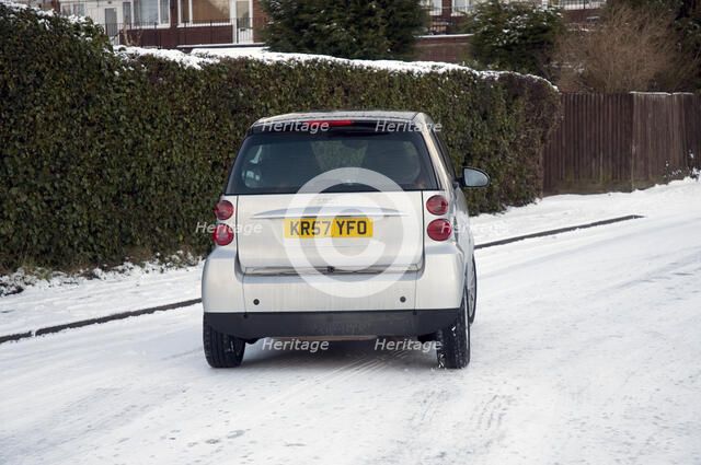2007 Smart car sliding on snowy road Artist: Unknown.
