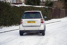 2007 Smart car sliding on snowy road