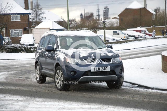 2008 Mitsubishi Outlander driving in snow Artist: Unknown.