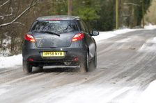 2009 Mazda 2 driving on snowy road