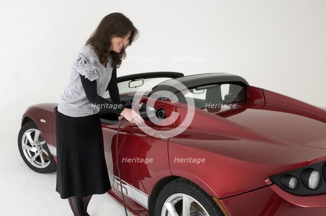 2010 Tesla Roadster electric car being re charged Artist: Unknown.