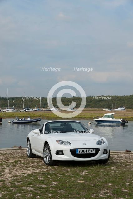2014 Mazda MX5 Roadster Coupe Artist: Unknown.